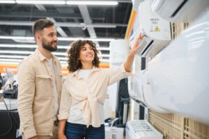 happy,couple,choosing,a,new,air,conditioner,in,an,appliance