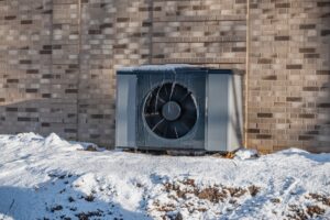 Air,Source,Heat,Pump,Unit,With,Icicles,Hanging,From,Casing
